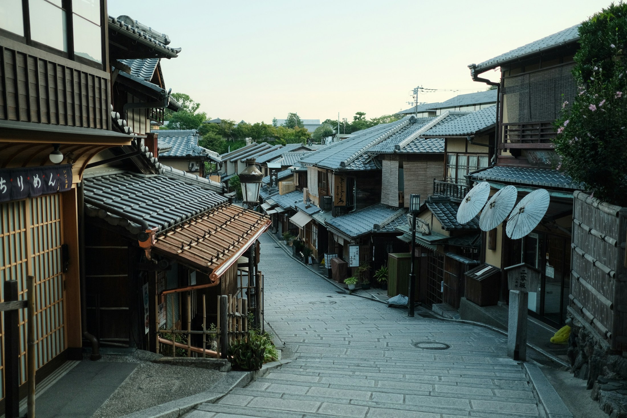 A traditional street lined with wooden buildings in Kyoto, Japan